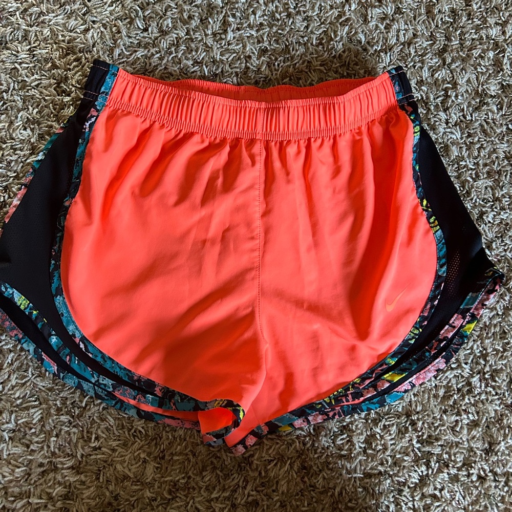 Nike running shorts. Bright neon orange and neon yellow with blue